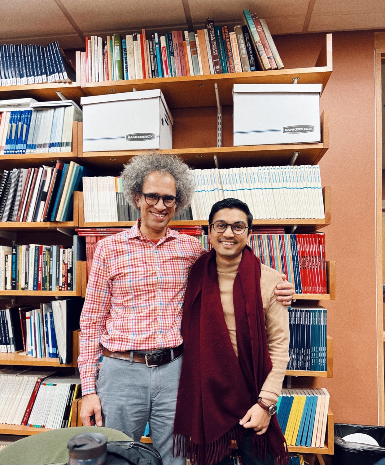 Professor Graham M. Jones and Deepak Ramola in the MIT anthropology library